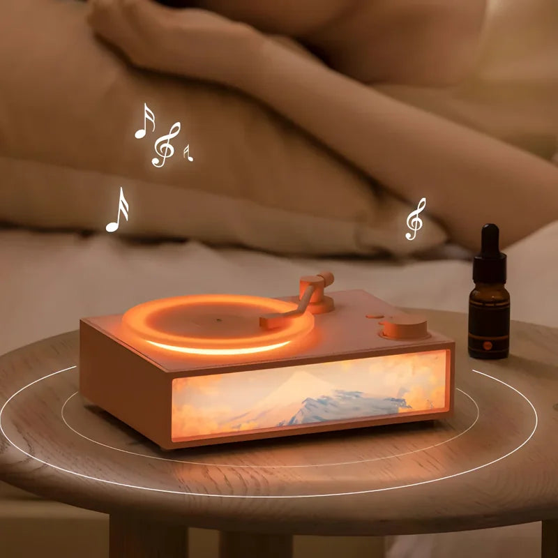gramofon zvučnik na noćnom stočiću pored osobe koja spava