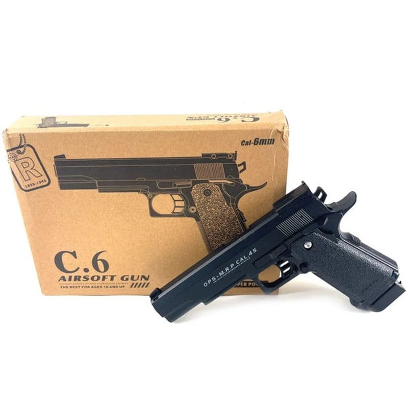 airsoft metalni pištolj C6 pored originalne kartonske kutije, kalibar 6mm