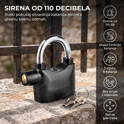 crni alarm katanac sa sirenom na kapiji, ključevi pored njega