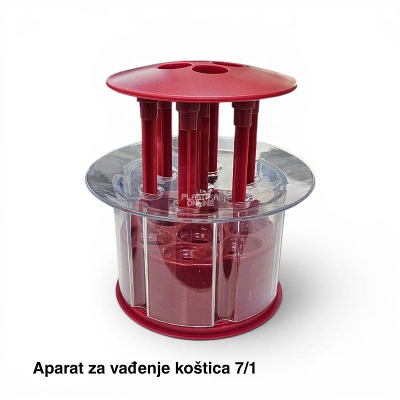 crveni uređaj sa podignutim klipovima iznad providnih komora za voće