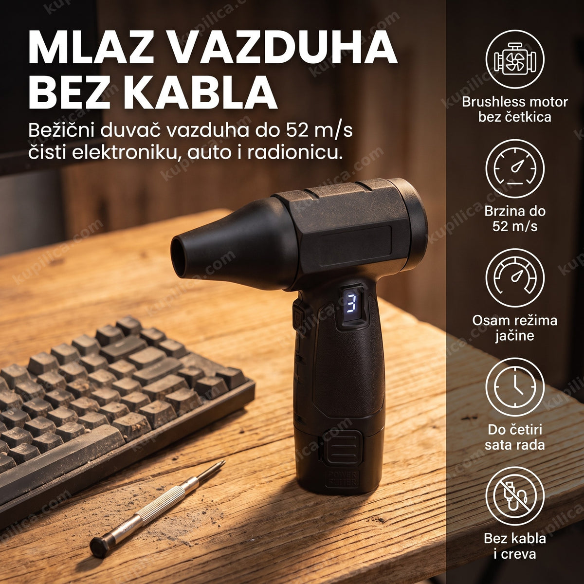 bežični duvač vazduha na radnom stolu pored alata u radionici