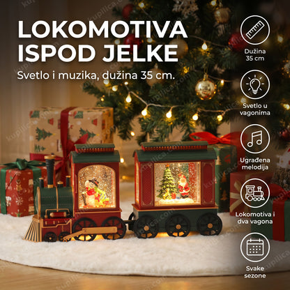 dekorativna lokomotiva sa deda mrazom i muzikom ispod novogodišnje jelke
