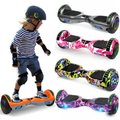 hoverboard 6.5 inča — dete u zaštitnoj opremi vozi narandžasti model, pored šarenih varijanti