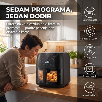 Mühler MFX815 friteza na vruć vazduh 8L — odrasla osoba prati pečenje kroz prozor friteze u kuhinji