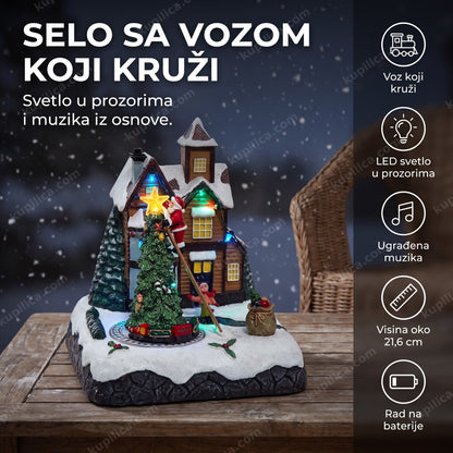 novogodišnje keramičko selo sa vozom na stolu zastakljene verande sa lampicama