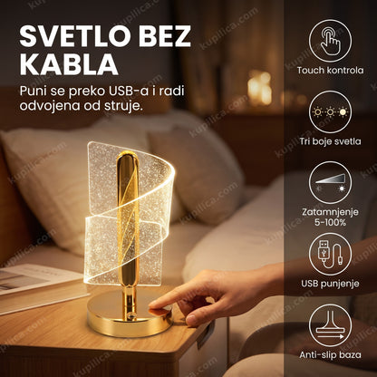 kristalna stona lampa touch — osoba dodiruje bazu kristalne lampe da zatamni svetlo na noćnom stočiću