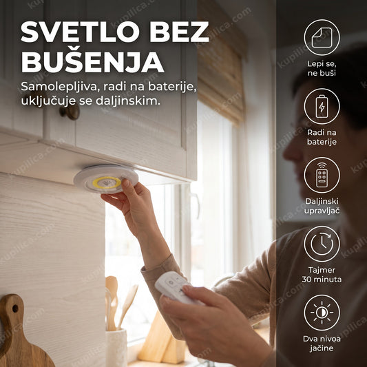 led lampa na baterije sa daljinskim — osoba lepi okruglu led lampu ispod kuhinjskog elementa i drži daljinski