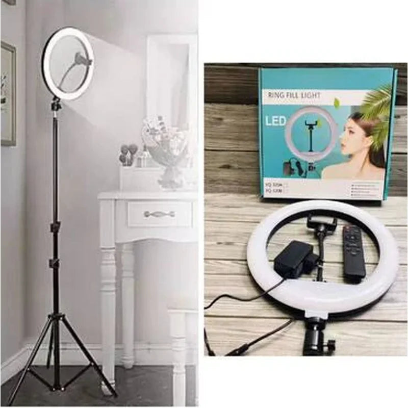 ring light sa stativom 36 cm pored toaletnog stočića, kutija i daljinski upravljač