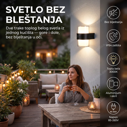 led zidna lampa v1278-v — cilindrična lampa na zidu terase uveče, svetlo ide gore i dole bez bleštanja, topla bela 3000k