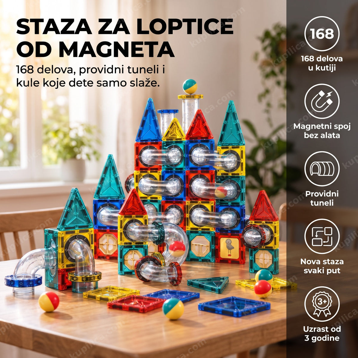 magnetna staza za loptice sa kulama i tunelima složena na drvenom stolu uz prozor