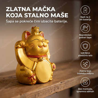 zlatna maneki neko figura koja maše šapom na polici u dnevnoj sobi