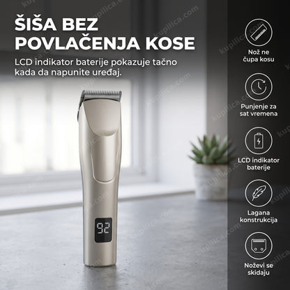 srebrna mašinica za šišanje kose sa LCD indikatorom na betonskoj površini pored biljke
