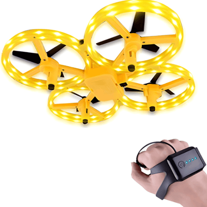 žuti dron sa led svetlima pored ruke sa senzorskom narukvicom za let