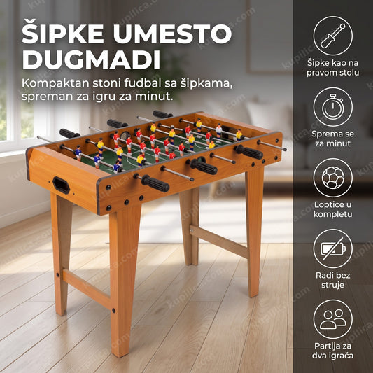 mini stoni fudbal sa šipkama i figuricama igrača na malom stolu