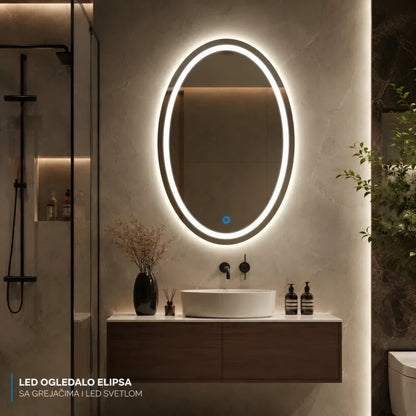 ovalno LED ogledalo sa grejačem iznad umivaonika u kupatilu sa tuš kabinom