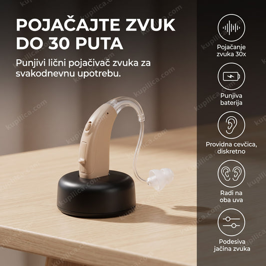 bež slušni aparat sa providnom cevčicom stoji na punjivom stalku
