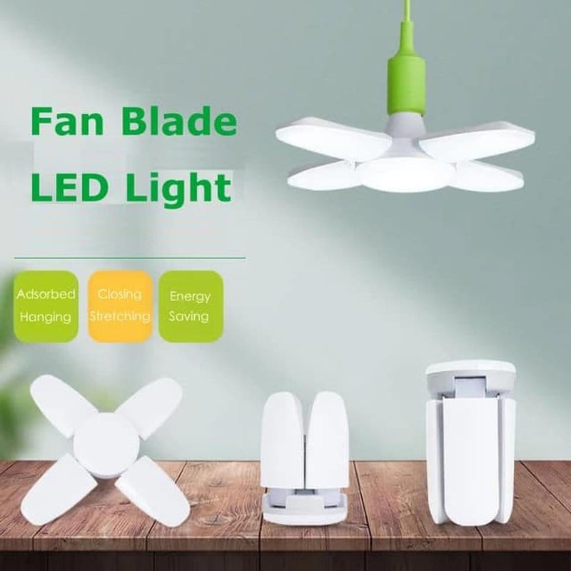rasklapajuća LED sijalica 60W upaljena i rasklopljena kao viseća lampa na stolu