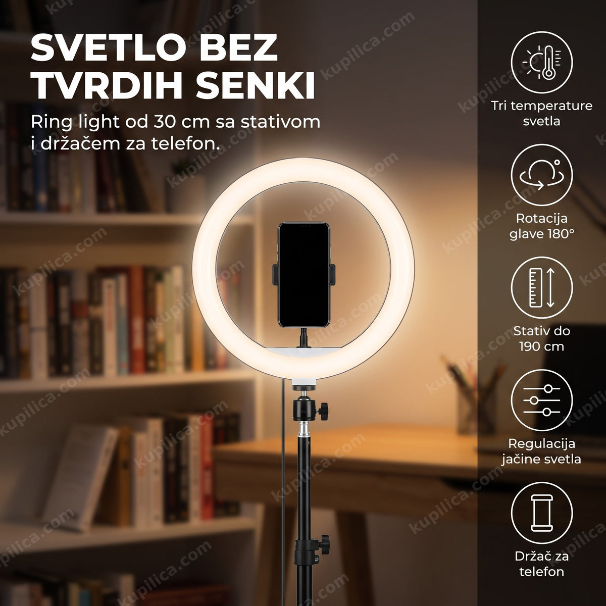 ring light sa stativom i držačem za telefon na stolu u sobi