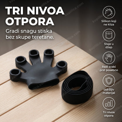 crni silikonski trener za prste sa tri nivoa otpora na drvenoj podlozi