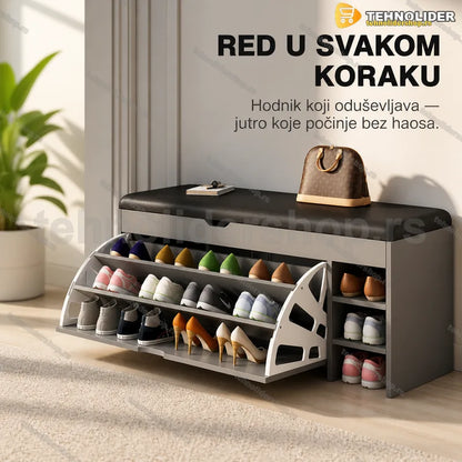 sivi cipelarnik sa tapaciranim sedištem u hodniku uz beli zid