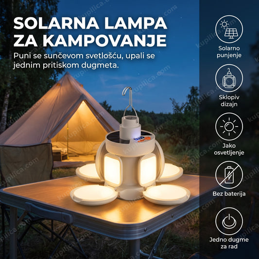 Solarna lampa za kampovanje osvetljava sto ispred šatora uveče