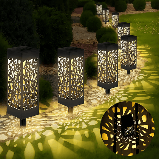 solarne lampe set 4 komada — lampe sa organskim izrezanim uzorkom duž kamene staze
