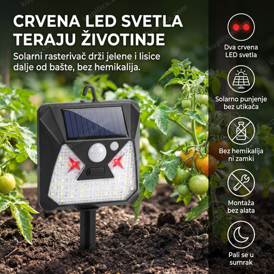 solarni rasterivač divljih životinja sa crvenim LED svetlima na ivici povrtnjaka danju
