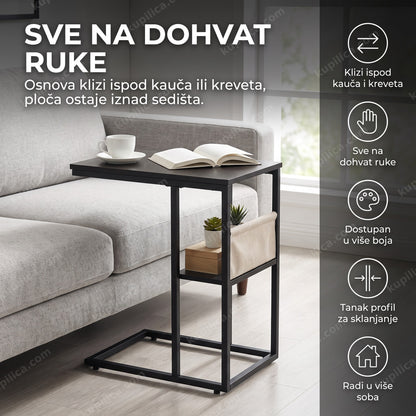 crni stočić c oblika pored kauča sa knjigom i šoljom kafe