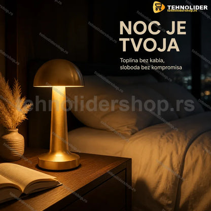 stona lampa pečurka punjiva Auraglow mat-zlatne boje na stolu
