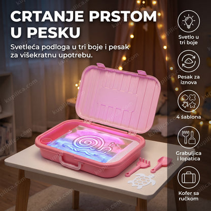 svetleća kutija sa peskom za crtanje sa roze svetlom i šablonom kornjače na stolu