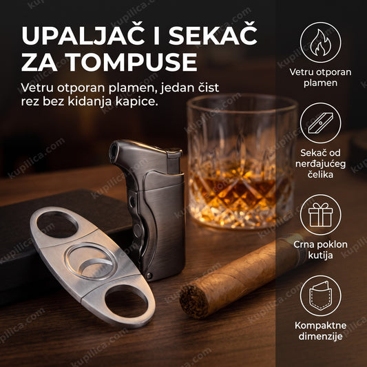 Metalni upaljač i sekač za tompuse na tamnom stolu uz čašu viskija