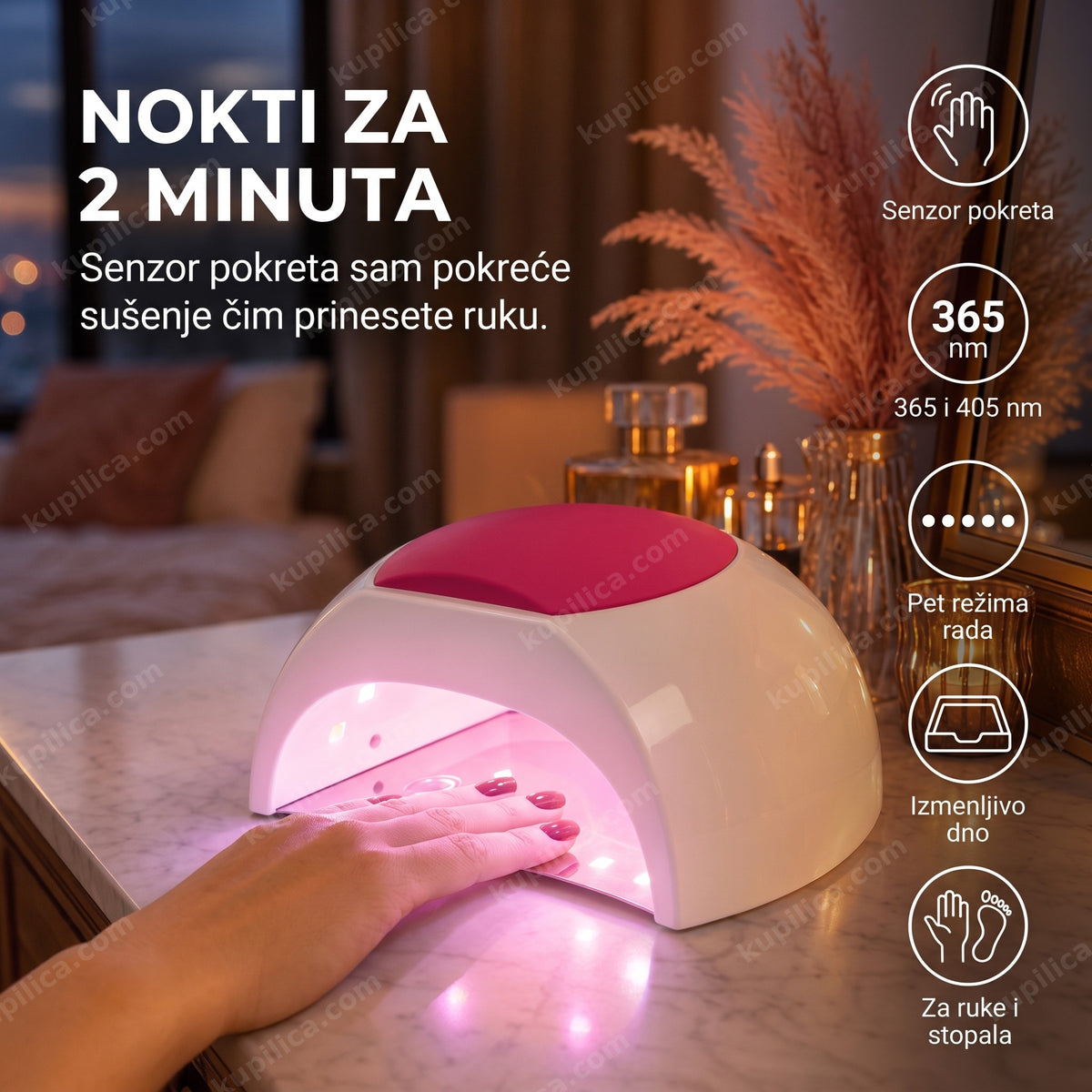 Šaka osvetljena roze svetlom unutar UV LED lampe za nokte na toaletnom stočiću