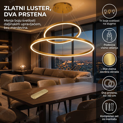 Zlatni luster sa dva prstena iznad trpezarijskog stola u elegantnom enterijeru
