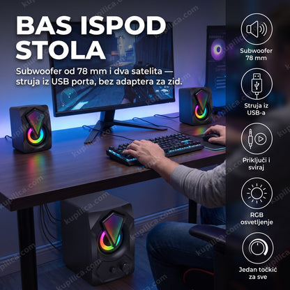 Igrač sedi za računarom sa RGB zvučnicima YST-1306, subwoofer stoji ispod stola